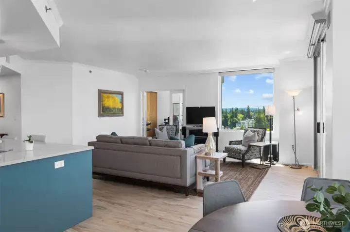 Dining area positioned to capture city and mountain views through oversized windows.