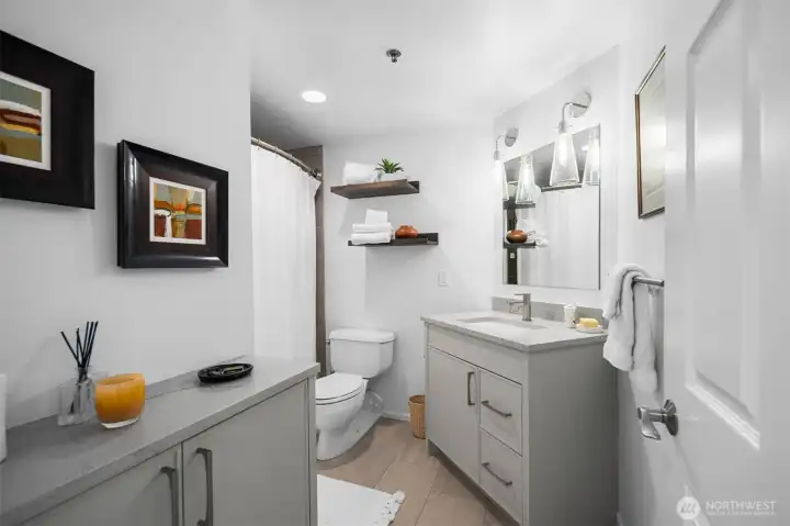 Remodeled full bath serving guest and secondary bedroom areas.