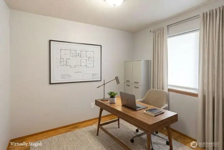 Main floor den is perfect for a home office, or fitness or craft room. This versatile space offers great functionality and can be easily adapted to suit various needs.