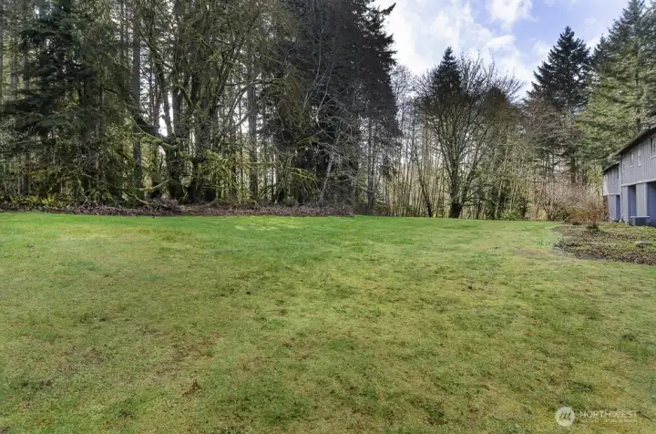 This beautifully maintained area is a direct responsibility of the Homeowners Association (HOA), ensuring a pristine and well-cared-for environment. The property is naturally bordered by lush, mature woods, providing a tranquil and secluded setting. Furthermore, the area features a network of accessible trails, perfect for outdoor enthusiasts who enjoy hiking and exploring the natural surroundings.