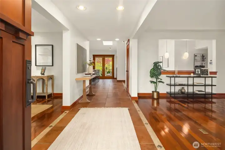 Grand entry with the living room to the right, formal dining room to the left