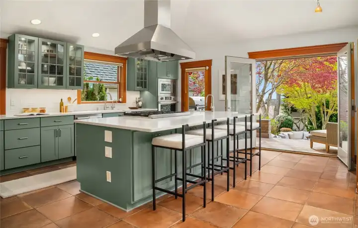 French door open up to patio with built-in BBQ.