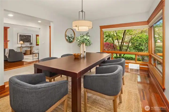 Formal dining room, surrounded by the floor-to-ceiling windows.