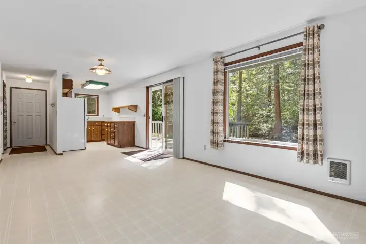 Living room, dining area and kitchen