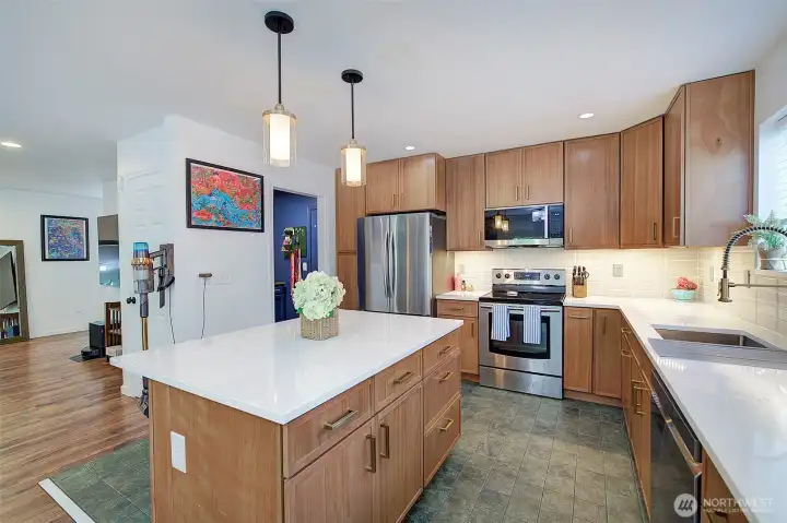 Newly updated kitchen with custom white oak       cabinets, quartz counters and Italian tiles w/stainless appliances