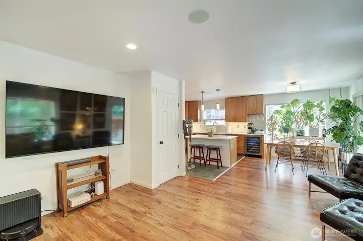 Open floor plan flows from living to dine in kitchen