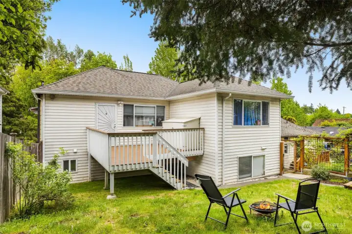 Private backyard and deck with storage.