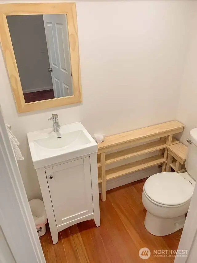 Unit B's newly created Added coat closet downstairs.     Added powder room 1/2 bath off living room.
