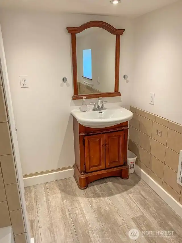 Remodeled unit B main bathroom to increase ceiling height.