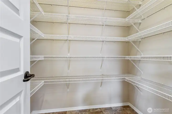 Impressive walk-in pantry offers exceptional storage and organization Impressive walk-in pantry offers exceptional storage and organization