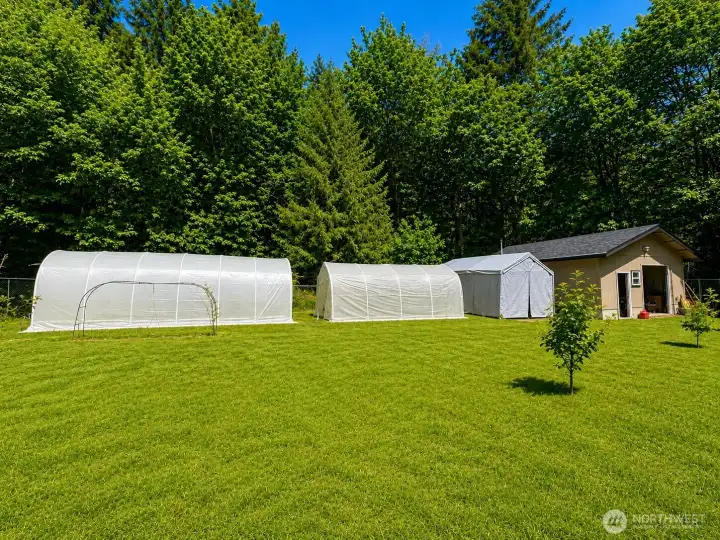 Private and peaceful country setting with versatile outbuildings and plenty of usable space. This well-maintained property features a large barn-style storage shed with wide double doors, ideal for equipment, tools, workshop space, hobbies, or recreational storage. Surrounded by mature trees and open lawn areas, the property offers a serene rural atmosphere with room to garden, entertain, or expand outdoor living. Additional covered storage structures provide even more flexibility for vehicles, projects, or seasonal equipment. Enjoy the beauty of the natural setting, sunny open spaces, and the privacy of a tucked-away homesite while still having functional improvements already in place.