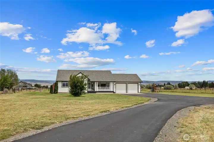 A charming 3 bed, 2 bath home on 5 acres with a huge shop!