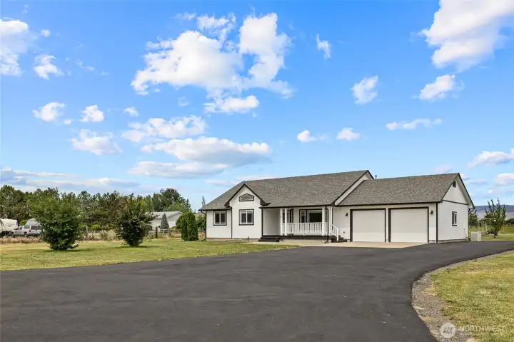 The charming home sits nicely on the 5 acre parcel. Home has a 2 car garage as well as the shop. Plenty of room for storage.