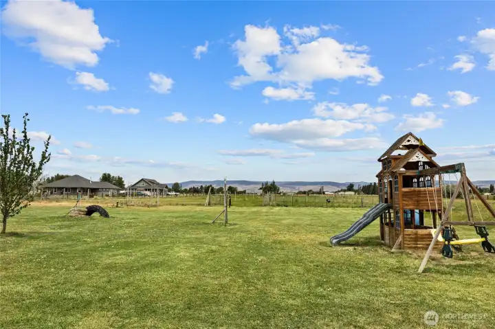 Beautiful view of the nice lush green flat land. Great outdoor play area for the little ones.