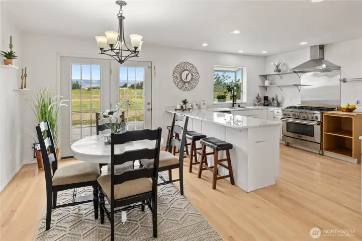 A view of the dining room with the open concept to the nicely updated kitchen.