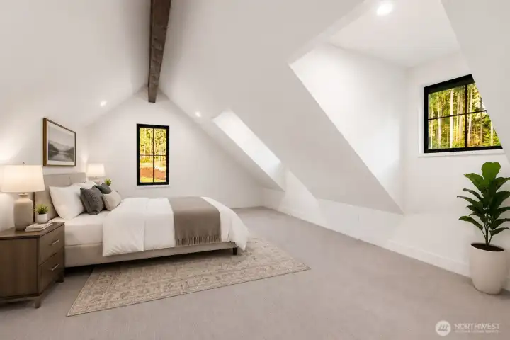 One of the upstairs bedrooms with vaulted ceilings One of the upstairs bedrooms with vaulted ceilings