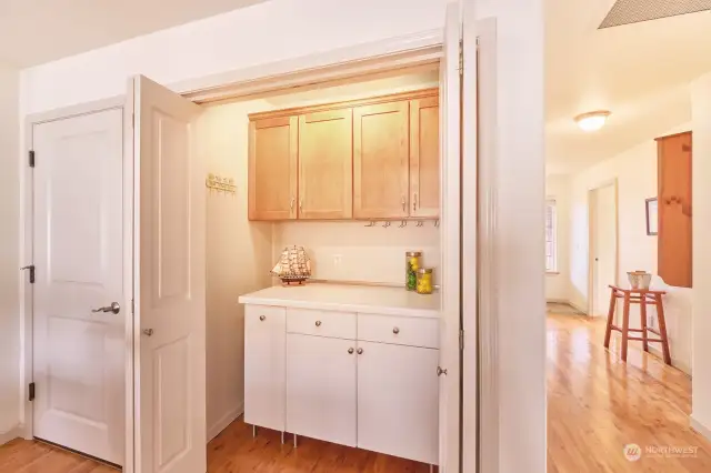 Extra pantry space, with entrance to garage alongside.