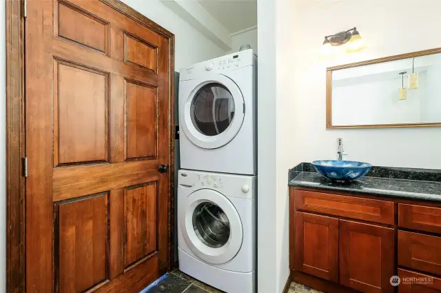 Stackable washer/dryer in principal bathroom.