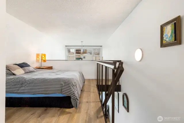 Roomy bedroom that overlooks the light-filled living room.