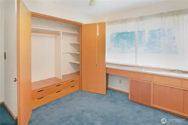 Bedroom 2, with built-in desk and closet storage