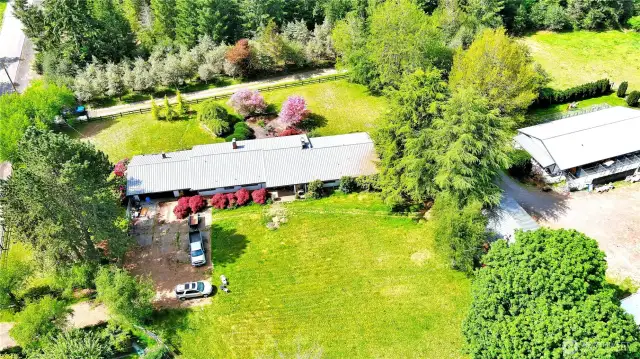 Main home, driveway to the North in photo, is first driveway