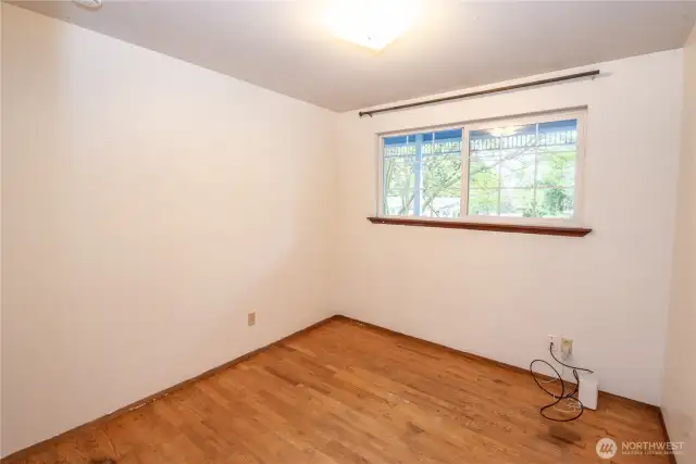 First bedroom. Hard wood floors.