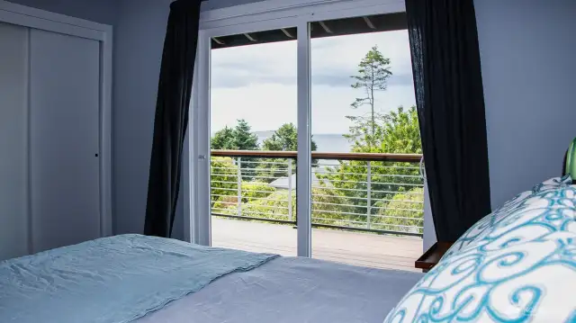 Main bedroom with sliders to deck and double closets.