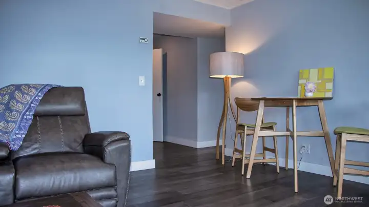 Multi-purpose room looking towards interior door to upper level. This is a full private apartment. Hallway to right goes to bedroom and kitchenette.