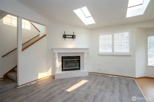 A beautiful fireplace anchors the living area—ideal for Pacific Northwest comfort.