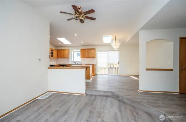 Seamless flow from the living area into dining and kitchen.