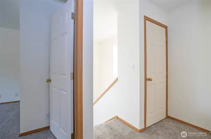 Upper level landing includes a handy closet for extra storage.