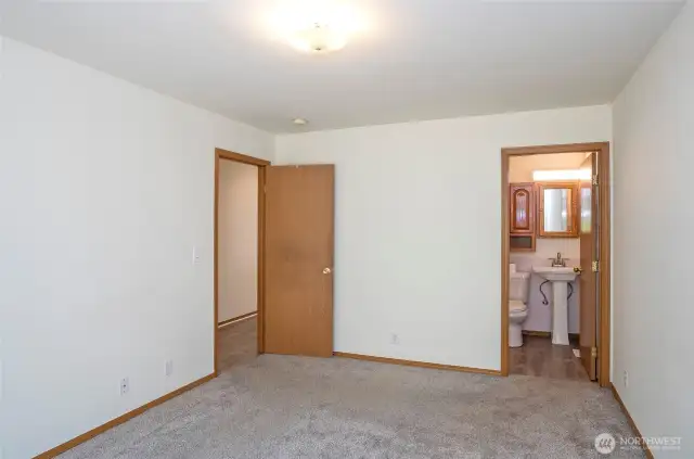 Primary suite offers added convenience with private full bath.