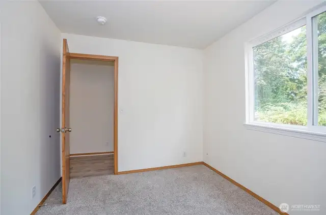 Alternate perspective of the den/office on the main floor with large window.