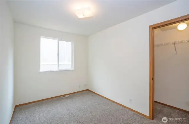 Guest suite #1 on the main level featuring a walk-in closet.