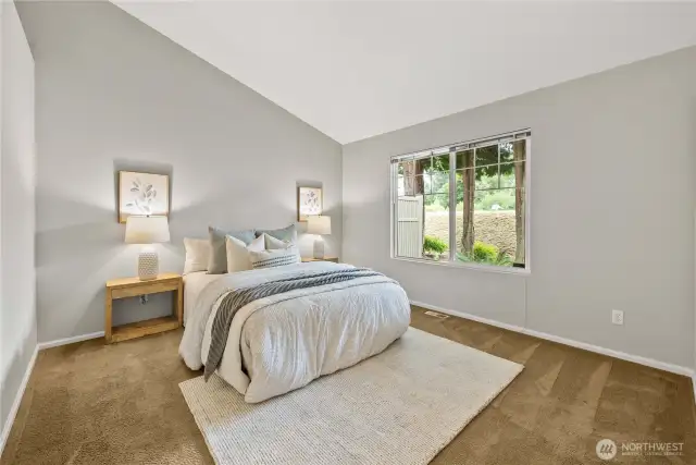 Spacious primary bedroom with plenty of room to relax and unwind.