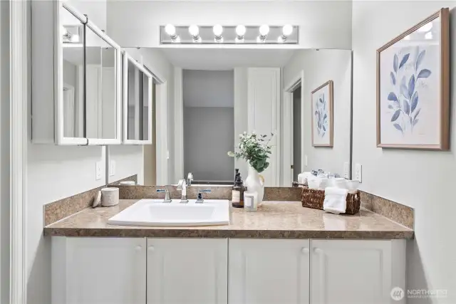 Spacious bathroom vanity with plenty of countertop and storage space.