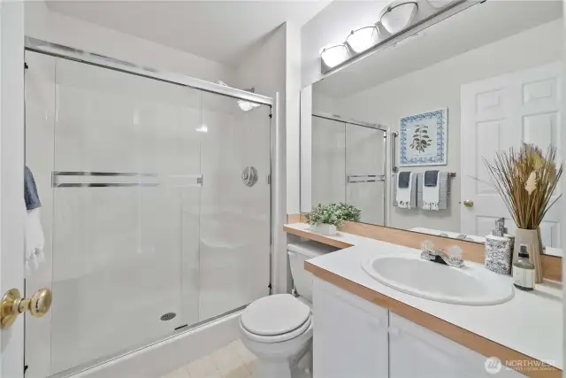 Large shower designed for convenience and relaxation.