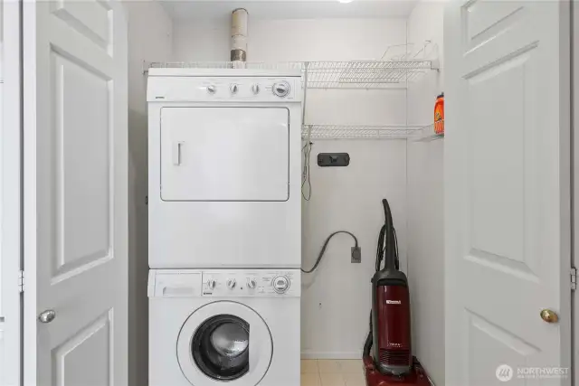 Efficient laundry setup with stackable washer and dryer to maximize space.