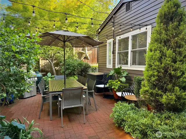 Garden patio with cottage on the right