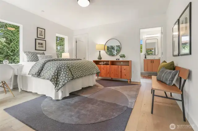 There are two more bedrooms on the second floor, both with en-suit baths boasting heated floors.