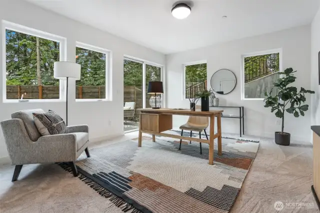 The fourth bedroom/office downstairs opens to a private patio.