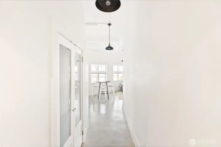 Hallway with spacious closet, which is laundry ready if desired