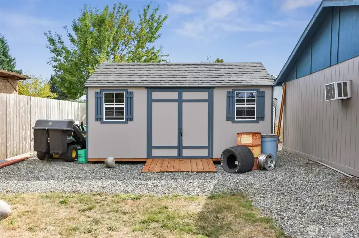 Cute Garden Shed tucked behind the garage.