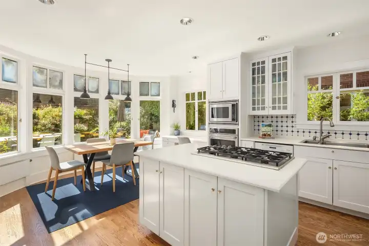 The south-facing kitchen is bathed in natural light, creating a warm and inviting space for cooking and entertaining.