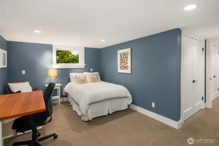 The basement conversion includes a thoughtfully added guest bathroom, completing the fully renovated lower level.
