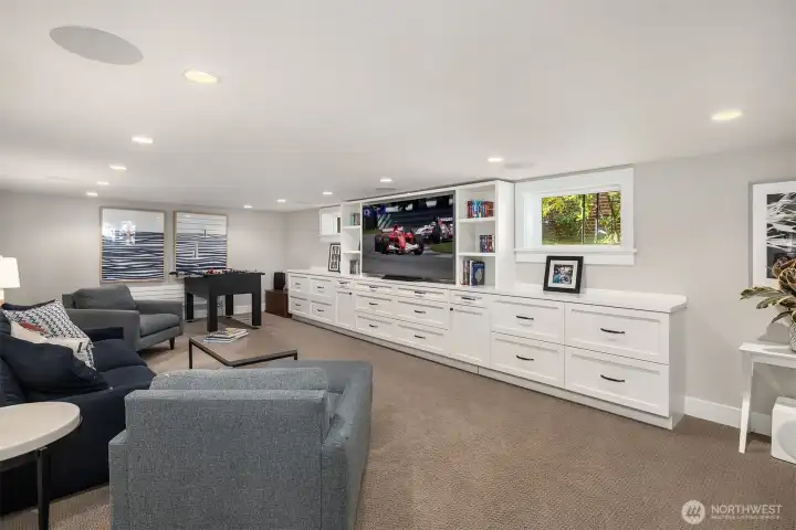Enjoy a custom-built TV and book storage unit, combining functionality with refined design.