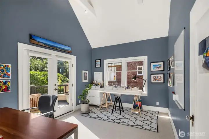 Whether used as an office, bedroom, or flex space, this sunlit room offers abundant natural light and a private deck for relaxation.