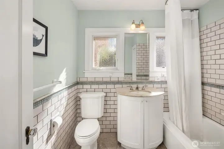 Upper-level guest bathroom combines classic charm with practical, functional appeal.