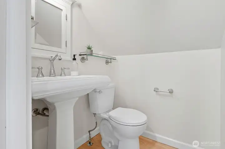 Half bathroom in the primary suite with room to expand and make this a true spa.
