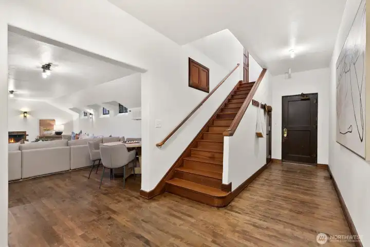 Stairs to lower level family room and bath